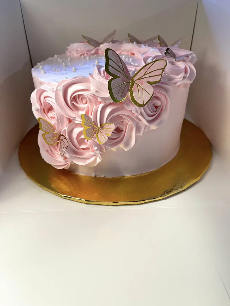 Pink rosette cake with gold-edged butterflies